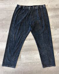 Pair of blue leggings on a wooden floor